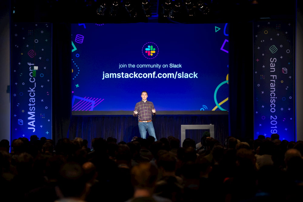 The JAMstack_conf stage with a link to the community slack